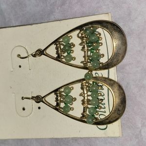 A pair of dangling green beaded earrings